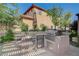 Outdoor kitchen with stainless steel appliances including a grill, sink, and refrigerator at 16 Mallard Creek Trl, Henderson, NV 89052