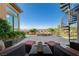 Gorgeous outdoor patio with a water feature, spiral staircase, and comfortable seating area at 16 Mallard Creek Trl, Henderson, NV 89052