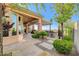 Outdoor patio featuring a built-in bar area, beautiful landscaping, and a shaded pergola at 16 Mallard Creek Trl, Henderson, NV 89052