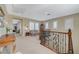 Spacious upstairs landing features a cozy seating area, plantation shutters and natural light at 16 Mallard Creek Trl, Henderson, NV 89052