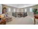 Bright upstairs landing with seating, plantation shutters, and access to multiple rooms at 16 Mallard Creek Trl, Henderson, NV 89052
