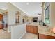 Wet bar with granite countertops, cabinets, and bar-height seating off of living room at 16 Mallard Creek Trl, Henderson, NV 89052