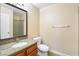 Bathroom features single vanity with stone countertops and standing shower with tile surround at 1836 N Decatur Blvd # 203, Las Vegas, NV 89108