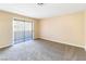 Bright bedroom featuring a sliding glass door that fills the space with natural light at 1836 N Decatur Blvd # 203, Las Vegas, NV 89108