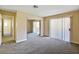 Inviting bedroom featuring carpet, neutral walls, and a mirrored closet for ample storage at 1836 N Decatur Blvd # 203, Las Vegas, NV 89108