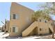 Charming two-story condo with light brown stucco and covered walkways leading to the units at 1836 N Decatur Blvd # 203, Las Vegas, NV 89108