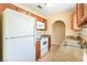 Well-equipped kitchen featuring granite countertops, white appliances, and ample cabinet space at 1836 N Decatur Blvd # 203, Las Vegas, NV 89108