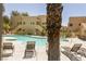 Resort-style pool area offers a relaxing atmosphere with lounge chairs and lush landscaping for residents at 1836 N Decatur Blvd # 203, Las Vegas, NV 89108