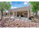 Beautiful backyard featuring a covered patio with outdoor seating, perfect for enjoying the serene surroundings at 2279 Keego Harbor St, Henderson, NV 89052
