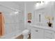 Bright bathroom featuring a glass shower door, tile surround, and modern vanity at 2279 Keego Harbor St, Henderson, NV 89052