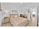 Comfortable bedroom with soft lighting, ceiling fan, neutral color palette and wood look flooring at 2279 Keego Harbor St, Henderson, NV 89052