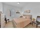Cozy bedroom with soft lighting, ceiling fan, neutral color palette and wood look flooring at 2279 Keego Harbor St, Henderson, NV 89052