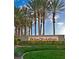 Inviting community entrance sign surrounded by lush landscaping and tall palm trees, setting a welcoming tone at 2279 Keego Harbor St, Henderson, NV 89052