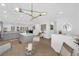 Bright dining area with open concept view of the kitchen, quartz countertops and pendant lighting at 2279 Keego Harbor St, Henderson, NV 89052