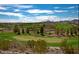Scenic view of the golf course, featuring lush green fairways, sand traps, and beautiful desert landscaping at 2279 Keego Harbor St, Henderson, NV 89052