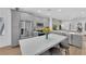 Spacious kitchen with stainless steel appliances and an island that opens up to a living area at 2279 Keego Harbor St, Henderson, NV 89052