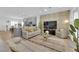 Open concept living space with natural light, light walls and stylish furniture at 2279 Keego Harbor St, Henderson, NV 89052