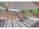 Covered patio area with sleek furniture, creating a cozy outdoor retreat at 2279 Keego Harbor St, Henderson, NV 89052