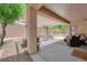Covered patio with gravel and concrete, offering a relaxing outdoor living space at 2279 Keego Harbor St, Henderson, NV 89052