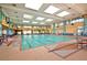 Bright indoor pool area featuring ample seating, tile accents, and a clear view of the water at 2279 Keego Harbor St, Henderson, NV 89052