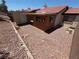 Backyard view showcasing a home exterior, shed and low-maintenance desert landscaping with gravel at 2362 Sierra Sunrise St, Las Vegas, NV 89156