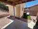 Backyard view of a small shed, chair and stone landscaping at 2362 Sierra Sunrise St, Las Vegas, NV 89156
