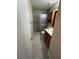 This bathroom features an enclosed shower, wood cabinets, and stylish tile flooring at 2362 Sierra Sunrise St, Las Vegas, NV 89156