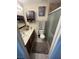 Bathroom featuring a spacious vanity, mirror, cabinets, and a walk-in shower at 2362 Sierra Sunrise St, Las Vegas, NV 89156