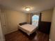 Bedroom with wood laminate flooring, single bed and a brown dresser at 2362 Sierra Sunrise St, Las Vegas, NV 89156