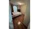 Bedroom with wood laminate flooring, single bed and a brown dresser at 2362 Sierra Sunrise St, Las Vegas, NV 89156