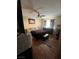 Bedroom with hardwood floors, ceiling fan, dresser, and a comfortable bed at 2362 Sierra Sunrise St, Las Vegas, NV 89156