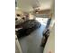Spacious garage interior with epoxy flooring, storage shelves, and a black sedan inside at 2362 Sierra Sunrise St, Las Vegas, NV 89156