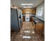 Modern kitchen with wooden cabinetry, stainless steel appliances, and a stylish backsplash at 2362 Sierra Sunrise St, Las Vegas, NV 89156