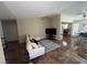 The living room features tile floors, a comfortable couch, and a view of the kitchen at 2362 Sierra Sunrise St, Las Vegas, NV 89156