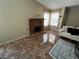 Inviting living room featuring a decorative fireplace and bright windows that let in plenty of natural light at 2362 Sierra Sunrise St, Las Vegas, NV 89156