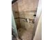 Bathroom shower with glass doors and tiled walls, and a built-in shower head and faucet at 2362 Sierra Sunrise St, Las Vegas, NV 89156