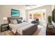 Bright bedroom with a large window and a gray upholstered bed frame at 2561 Terrytown Ave, Henderson, NV 89052