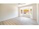 Bright bedroom with large window and wood look flooring at 2561 Terrytown Ave, Henderson, NV 89052