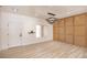 Empty room featuring wood-look floors, modern lighting, and natural light at 2561 Terrytown Ave, Henderson, NV 89052