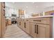 Kitchen featuring a large island with light wood cabinets and modern hardware at 2561 Terrytown Ave, Henderson, NV 89052