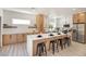 Modern kitchen featuring a large island with seating and stainless steel appliances at 2561 Terrytown Ave, Henderson, NV 89052