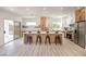 Open kitchen featuring a large island with seating, modern appliances, and light wood cabinets at 2561 Terrytown Ave, Henderson, NV 89052
