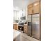Kitchen with stainless steel appliances, two-tone cabinetry, and modern countertops at 2561 Terrytown Ave, Henderson, NV 89052
