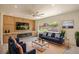 Cozy living room with large windows, built-in cabinets, and comfortable seating at 2561 Terrytown Ave, Henderson, NV 89052