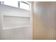 Modern shower showcasing light wood accent wall, a niche, and accent window at 2561 Terrytown Ave, Henderson, NV 89052