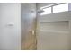 Modern shower featuring neutral tile, niche, rainfall shower head, and hand held sprayer at 2561 Terrytown Ave, Henderson, NV 89052
