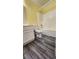 Cozy bathroom with shower-tub combo, toilet, vanity, and gray wood-look flooring at 2707 Gardenia Flower Ave, North Las Vegas, NV 89031