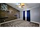 Bedroom with vaulted ceiling, unique accent wall, and neutral carpet at 2707 Gardenia Flower Ave, North Las Vegas, NV 89031