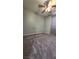Empty bedroom featuring neutral carpet, a ceiling fan, and light green walls at 2707 Gardenia Flower Ave, North Las Vegas, NV 89031