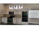 Bright kitchen with white cabinets, stainless steel appliances and a double oven at 2707 Gardenia Flower Ave, North Las Vegas, NV 89031
